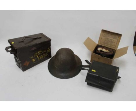 Second World War tin helmet, together with two gas masks in box and a metal ammunition case (1 box) 