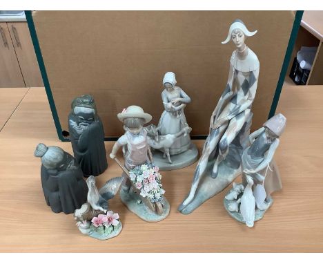 Four Lladro figures, boxed, two others and a Nao figure