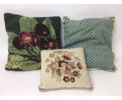 A selection of embroidered and tapestry items and samples.