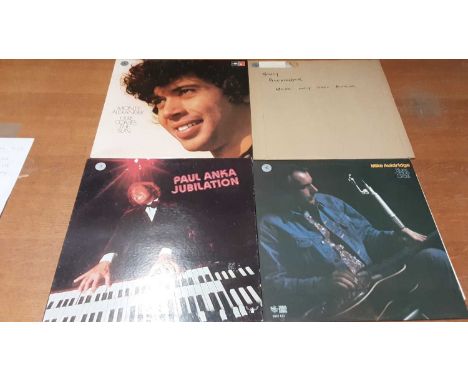 Three vintage carry cases of LP records including Elton John, Cat Stevens, Leonard Cohen, Bruce Springsteen and Donovan.Condi