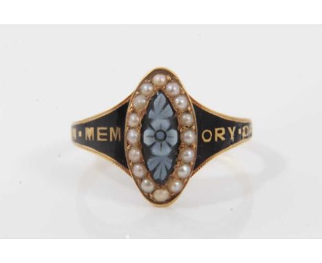 Victorian 18ct gold and black enamel mourning ring with carved hardstone cameo depicting a forget-me-not surrounded by seed p