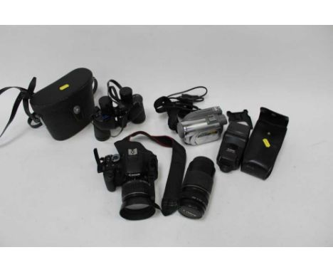 Canon EOS 600D digital SLR camera, in case with two lenses, charger and accessories, together with a tripod, video camera, fl