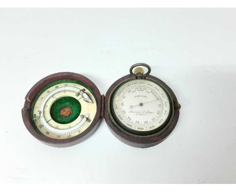 Late 19th / early 20th century pocket barometer by Lawrence &amp; Mayo, London, 5cm diameter, in leather case with thermomete