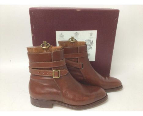 A pair of John Lobb boots described on receipt as Brown Strap Jods, with three piece wooden trees, in original box. Price 198