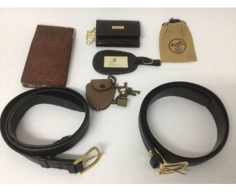 Vintage Gucc accessories including black leather belt, leather luggage tag, padlock with leather case and key case. Plus a sm