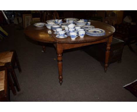 Large oak drop leaf dining table raised on ring turned supports with casters^ 157cm wide