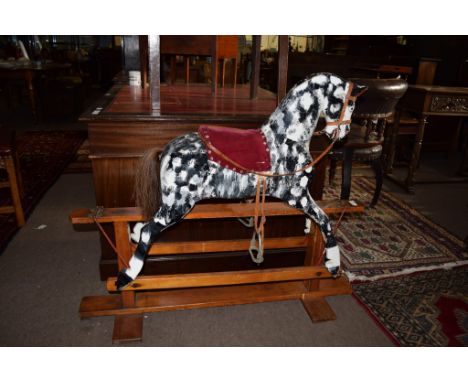 Vintage rocking horse painted in grey dapple on a pine stand^ 96cm high