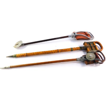 An early 20thC bamboo and cane French shooting stick, 88cm high, and two English shooting sticks, 82.5cm and 83cm high respec