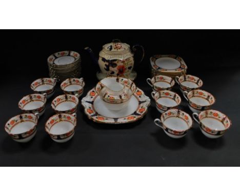 An early 20thC Tuscan porcelain tea service, decorated with flowers, comprising a pair of bread plates, cream jug and sugar b