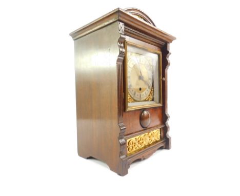 A French early 20thC oak cased mantel clock, square brass dial with foliate spandrels, silver chapter ring bearing Roman nume