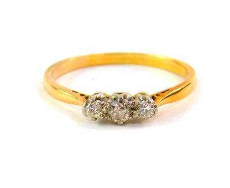 A diamond three stone ring, set in yellow metal, approx 1/8th carat, size P, 2.0g. 