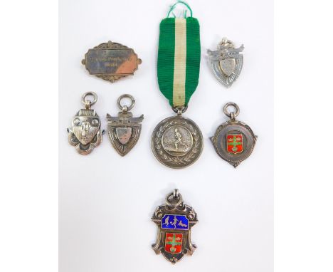 A silver and enamel football medal, engraved Notts Minor Comtn Winners 1931-1932., Runners-Up medal 1931-1932., NML medal 192