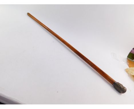 An Anglo Indian late 19thC malacca walking stick, with a white metal knop embossed with Hindu deities, circular reserve monog