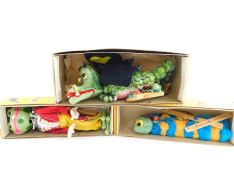 Three Pelham puppets, boxed, comprising Frog, Caterpillar and Dragon.  On initial inspection the caterpillar appears to have 