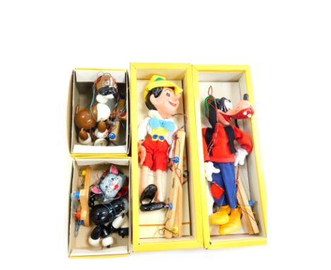 Four Pelham puppets, boxed, comprising Pinocchio, Goofy, Cat and Bengo.  On initial inspection all puppets appear without dam