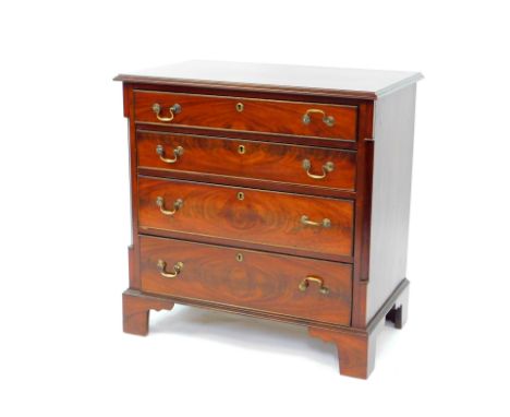 An Edwardian mahogany chest of four long graduated drawers, raised on bracket feet, 80cm high, 77.5cm wide, 49cm deep.