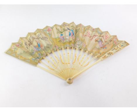 A Continental 19thC ivory and paper stick fan, painted with reserves of chinoiserie figures, against a ground of fruit and fl