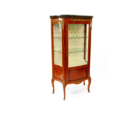 A Louis XV style mahogany and kingwood bow fronted vitrine, with a marble top, glazed sides and door opening to reveal two gl