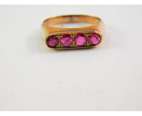 A ruby four stone ring, pave set in yellow metal, size J, 2.4g.