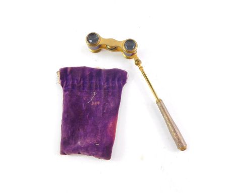 A pair of late Victorian lady's gilt metal opera glasses, with mauve enamel decoration and extendable handle, by J Duvelleroy