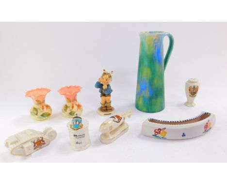 A group of ceramics, including a Hummel figure boy with toothache, crested china model of a British tank, Arms of Nottingham.