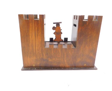 A vintage novelty 1930's wooden Mickey Mouse money box, formed as a castle with two keeps, 23cm wide.