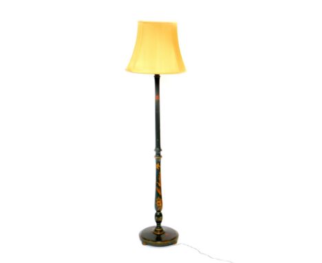 An early 20thC green Japanned lacquer standard lamp, decorated with dragons and flowers, with shade, 185cm high.