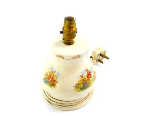 A Royal Doulton pottery Bunnykins table lamp, of baluster form, printed mark, 15cm high. 