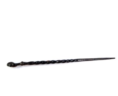 An African ebony walking stick, carved with the head of an indigenous man, 89cm high. 