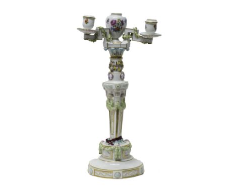 A Meissen three-light candelabrum, late 19th century, of classical form, the triangular tapered column moulded on each side w