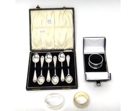 Silver, comprising; a set of six teaspoons, Birmingham 1926, cased, a Victorian napkin ring, with floral engraved decoration,