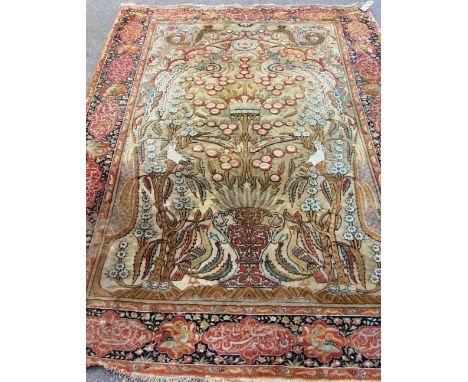 A Kashan Souf prayer rug, Persian, the beige mihrab with a vase filled with a floral tree centred with a coronet, pair of bir