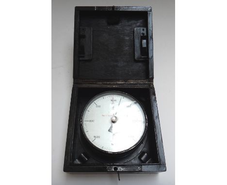 A German Kriegsmarine wall mounted barometer, the silvered dial bearing Waffen mark and '1067/obs Nur fur technischen Einsatz