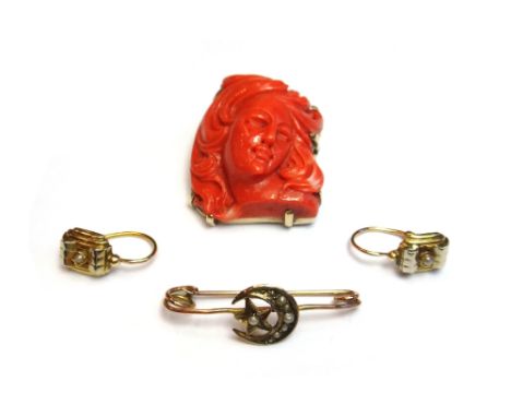 A gold mounted carved coral pendant brooch, carved as the portrait of a lady with flowing hair, a pair of gold and imitation 