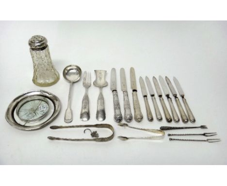 Silver and silver mounted wares, comprising; two pairs of sugar tongs, a glass sugar caster, a set of six tea knives, with pl