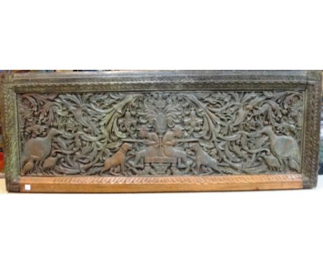 Three large rectangular carved wooden panels, South India or Dutch East Indies, 18th/19th century, one carved with two seated