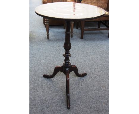 An early 19th century mahogany box strung occasional table, the circular snap-top with central patera inlay on baluster colum