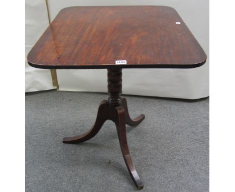A late Regency mahogany occasional table, the rounded rectangular snap-top on ring turned column and ebony strung tripod base