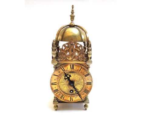 A brass lantern clock, 20th century, of typical form, enclosing a single train movement engraved 'Elliott London', 29cm high 