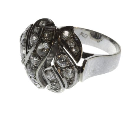 A diamond set cluster ring, pierced in an oval design, mounted with cushion shaped diamonds, ring size M and a half.  Illustr