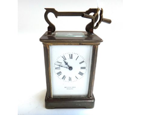 A brass cased carriage clock, early 20th century, the white enamel dial detailed Botly and Lewis, Reading, with portable trav