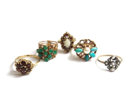 A gold, green and colourless gem set ring, in a five section design, a 9ct gold, opal and garnet set cluster ring, a 9ct gold