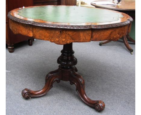 A Victorian mahogany walnut drum table, the shaped circular top over four frieze drawers on tripod base, 95cm wide. 