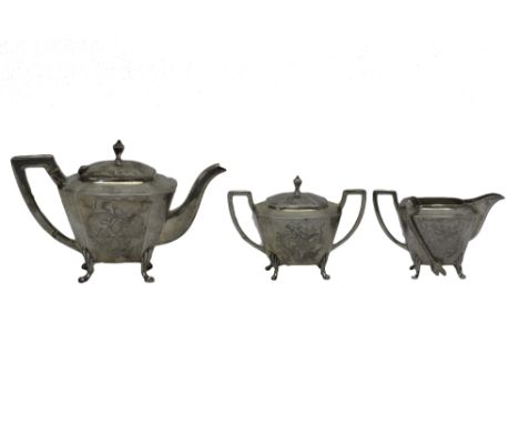 A Chinese three piece tea set, comprising; a teapot, a twin handled sugar bowl and cover with a pair of claw ended sugar tong