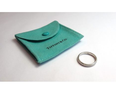 A Tiffany & Co platinum plain wedding ring, ring size N, weight 5 gms, with a Tiffany & Co pouch.