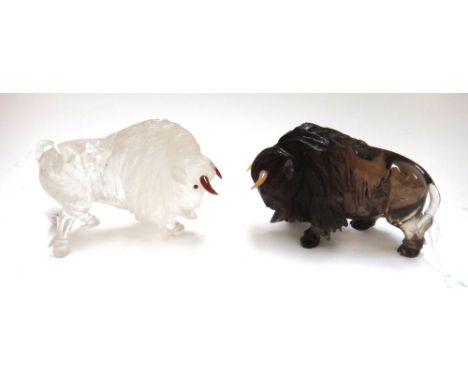 Two carved hardstone Buffalo of Fabergé design, 20th century, with coloured horns, (a.f.) 12.5cm high, (2). 