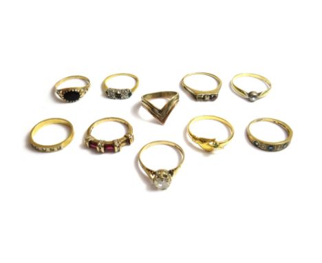 A 9ct gold sapphire and diamond set half hoop ring, a 9ct gold and oval black onyx set signet style ring, five gold and mostl