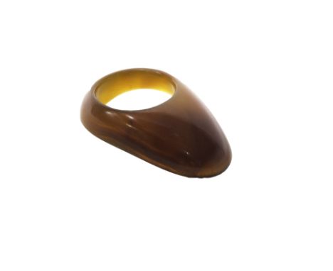 A carnelian archer's ring, Mughal India, 18th century, of typical form with deep amber brown colouring, 4.5cm.length.