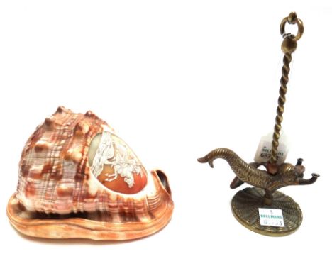 A Victorian carved cameo shell depicting George and the Dragon, 8cm high, and an unusual brass oil lamp modelled and cast as 