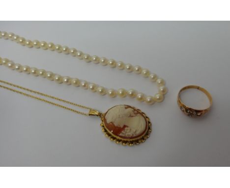 A 9ct gold mounted oval shell cameo pendant, carved as the portrait of a lady, with a gilt metal neckchain, a 9ct gold, rose 